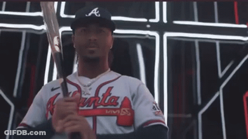 A Man In An Atlanta Braves Jersey Holds A Bat GIF