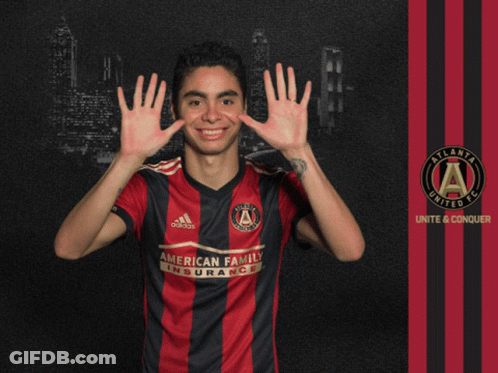A Man In An Atlanta United Fc Jersey Holds Up His Hands GIF
