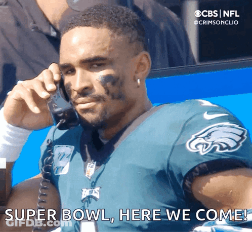 A Man In An Eagles Jersey Is Talking On A Phone And Says " Super Bowl Here We Come " GIF