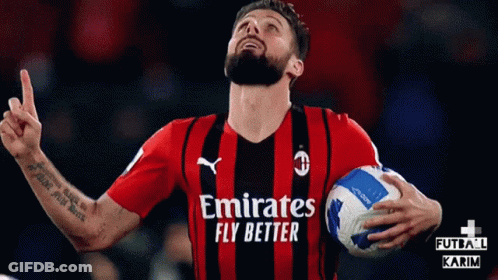 A Man In An Emirates Fly Better Jersey Holds A Ball GIF