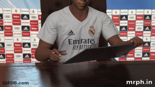 A Man In An Emirates Fly Better Shirt Signing A Contract GIF