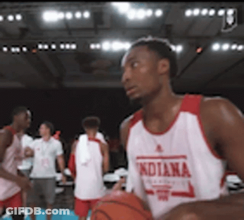A Man In An Indiana Jersey Holds A Basketball In His Hands GIF