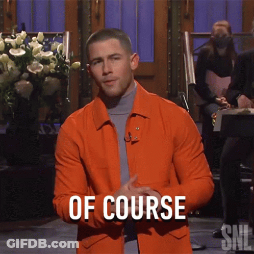 A Man In An Orange Jacket Stands In Front Of A Sign That Says " Of Course " GIF