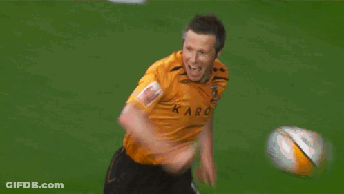 A Man In An Orange Jacket With A Crown Logo On His Arm GIF
