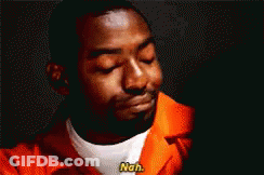 A Man In An Orange Jail Uniform Is Smiling And Says Nah . GIF