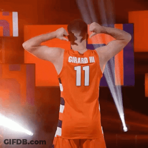 A Man In An Orange Jersey With The Number 11 On The Back GIF