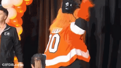 A Man In An Orange Jersey With The Number 70 On It GIF