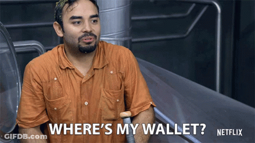 A Man In An Orange Shirt Is Asking Where 'S His Wallet GIF
