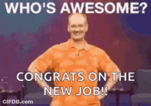 A Man In An Orange Shirt Is Congratulating Someone On A New Job . GIF