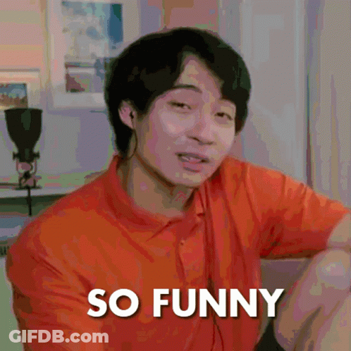 A Man In An Orange Shirt Is Making A Funny Face With The Words So Funny Below Him GIF
