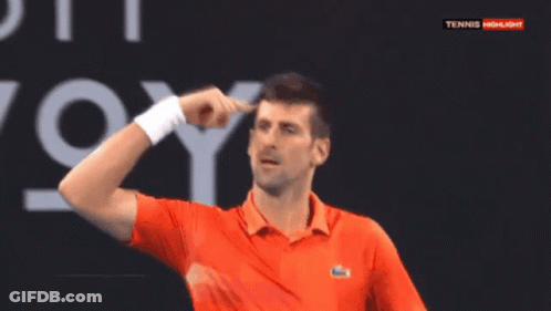 A Man In An Orange Shirt Is Pointing At His Head In Front Of A Tennis Highlights Sign GIF