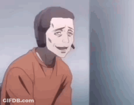 A Man In An Orange Shirt Is Sitting Next To A Wall . GIF