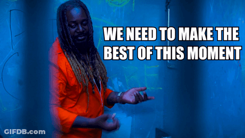 A Man In An Orange Shirt Is Standing In Front Of A Blue Background With The Words We Need To Make The Best Of This Momen GIF