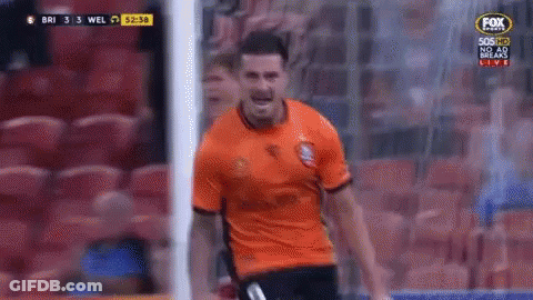 A Man In An Orange Shirt Is Standing In Front Of A Soccer Goal During A Game On Fox Sports GIF