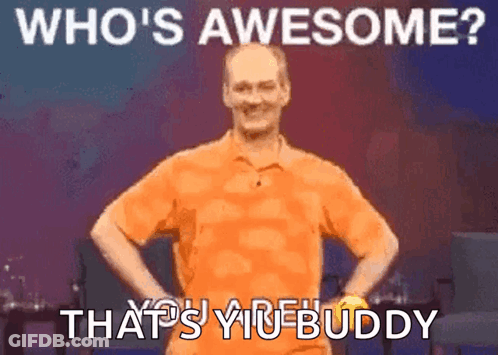 A Man In An Orange Shirt Is Standing With His Hands On His Hips And The Words Who 'S Awesome That 'S Your Buddy GIF