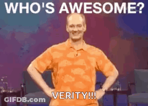 A Man In An Orange Shirt Is Standing With His Hands On His Hips And The Words `` Who 'S Awesome ? Verity !!! '' GIF
