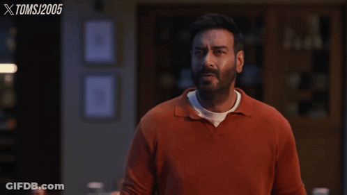 A Man In An Orange Shirt Says What Rubbish !! GIF