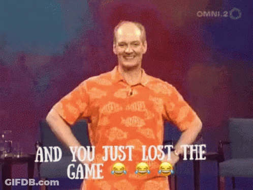 A Man In An Orange Shirt Stands With His Hands On His Hips And Says And You Just Lost The Game GIF