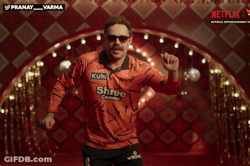 A Man In An Orange Shirt That Says Shree Cement GIF