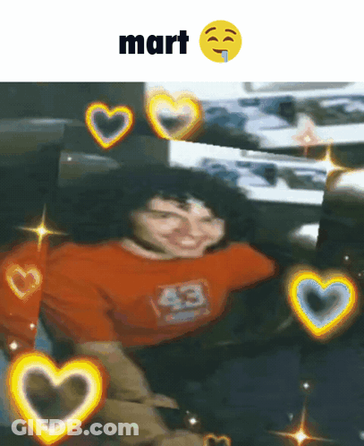 Man In Orange Shirt Surrounded By Hearts GIF