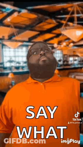 Man In Orange Shirt Saying Say What GIF