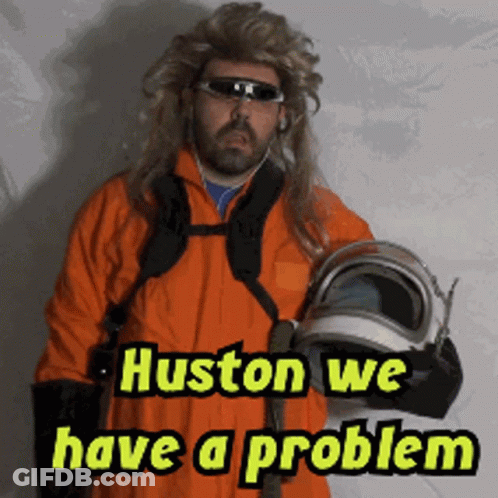 A Man In An Orange Suit Holding A Helmet With The Words Huston We Have A Problem GIF