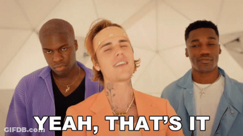 A Man In An Orange Suit Is Surrounded By Two Other Men With Yeah That 'S It Written Below Him GIF