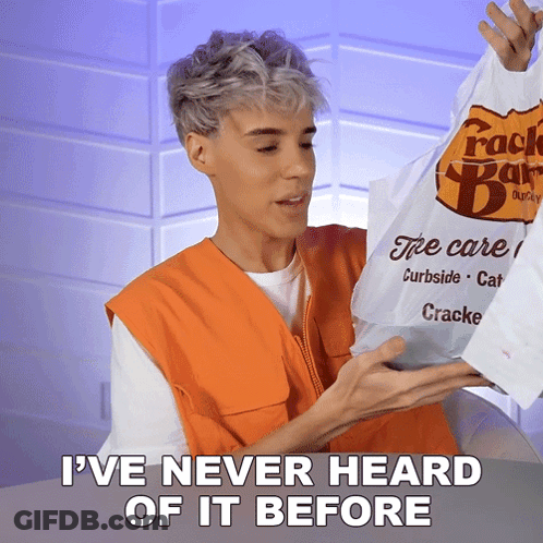 A Man In An Orange Vest Is Holding A Bag That Says Cracker Bar GIF