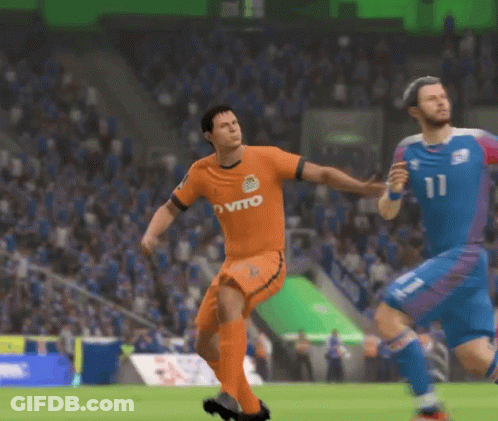 A Man In An Orange Vito Jersey Is Kicking A Ball GIF