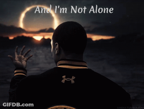A Man In An Under Armour Jacket Looks At A Sunset GIF