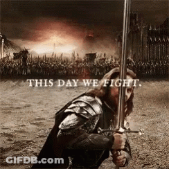 A Man In Armor Holding A Sword With The Words " This Day We Fight " Above Him GIF