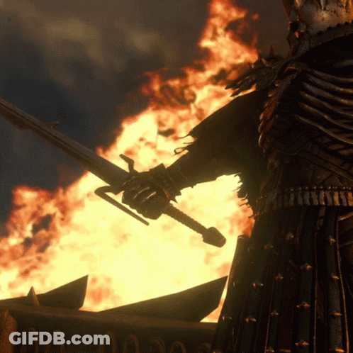 A Man In Armor Holds A Sword In Front Of A Fire And A Sign That Says ' A ' On It GIF