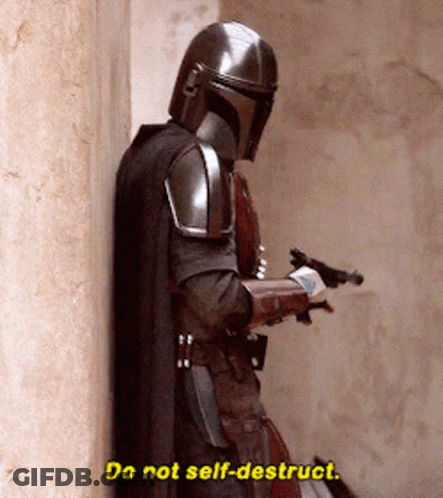 A Man In Armor Is Leaning Against A Wall And Saying Do Not Self-Destroy . GIF