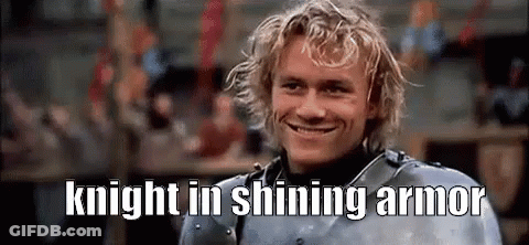 A Man In Armor Is Smiling With The Words `` Knight In Shining Armor '' Written Above Him . GIF