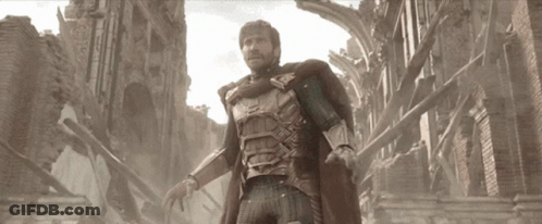 A Man In Armor Is Standing In Front Of A Brick Building GIF