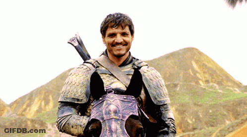 A Man In Armor Riding A Horse With A Sword On His Shoulder GIF