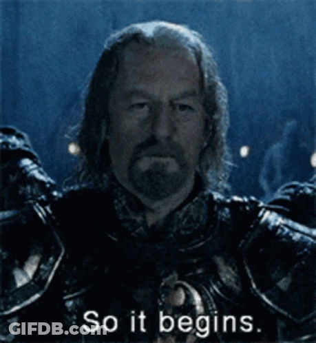 A Man In Armor Says So It Begins In A Dark Room GIF