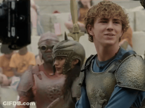 A Man In Armor Stands Next To A Woman In Armor GIF