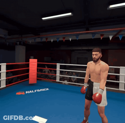 A Man In Boxing Gloves Stands In A Ring That Says Halfbrick On It GIF
