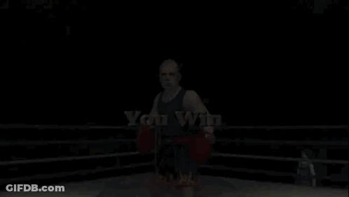 A Man In Boxing Gloves Stands In A Ring With The Words " You Win " On The Bottom GIF