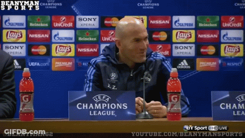 A Man In Front Of A Champions League Sign GIF