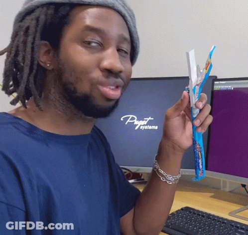 A Man In Front Of A Computer That Says Puget Systeme GIF