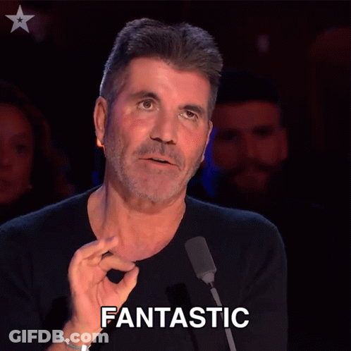 A Man In Front Of A Microphone Has The Word Fantastic Written On His Face GIF