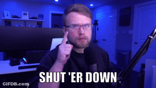 A Man In Front Of A Microphone Says Shut Er Down GIF