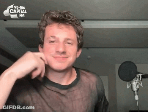 A Man In Front Of A Microphone With 95-106 Capital Fm Written On The Top GIF