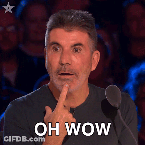 A Man In Front Of A Microphone With His Finger On His Chin And The Words Oh Wow Above Him GIF