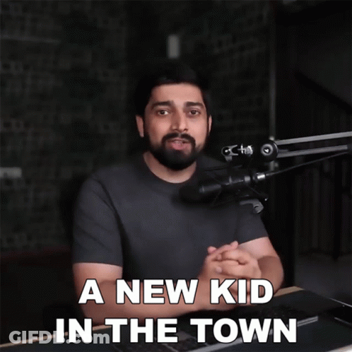 A Man In Front Of A Microphone With The Words " A New Kid In The Town " Below Him GIF