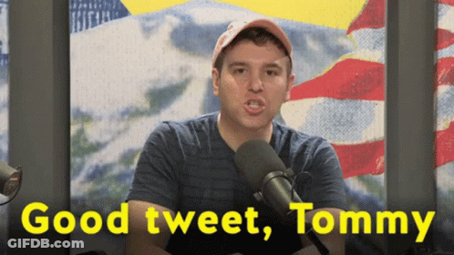 A Man In Front Of A Microphone With The Words " Good Tweet Tommy " Below Him GIF