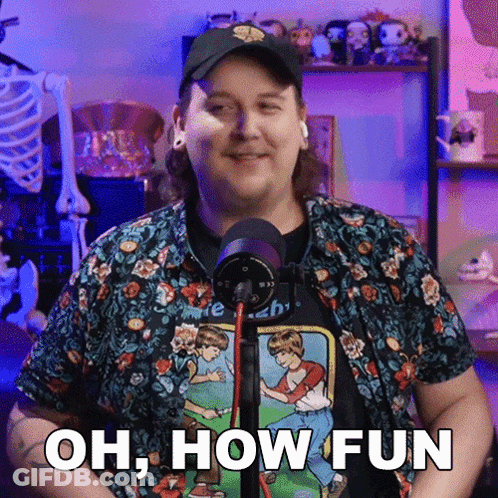 A Man In Front Of A Microphone With The Words Oh How Fun On His Shirt GIF