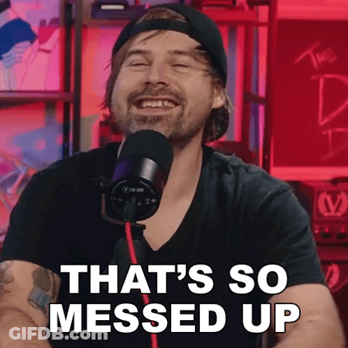 A Man In Front Of A Microphone With The Words That 'S So Messed Up Behind Him GIF
